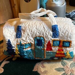 Hand Crafted White Travel Bag with Blue and Red Accents lined bag.